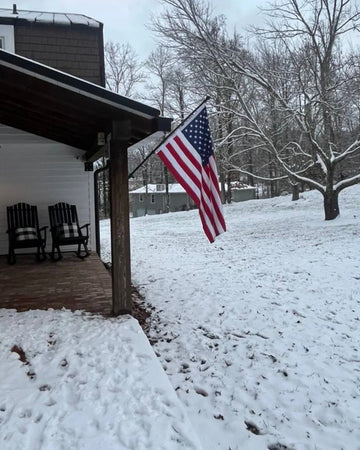 american flag in snow