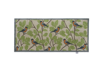 bullfinches on green branch hug rug