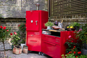 charlie outdoor cooker and kitchen island in flower garden