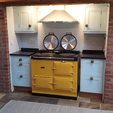 yellow aga in white kitchen