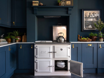 white esse range cooker in dark blue kitchen