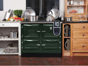 green esse wood fired cook stove in wood kitchen