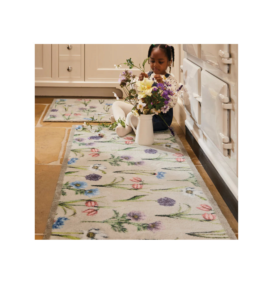 floral hug rug with child and flower vase