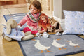 geese hug rug with child and toys