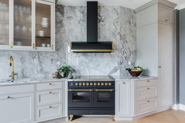 black milano range cooker in white and marble kitchen